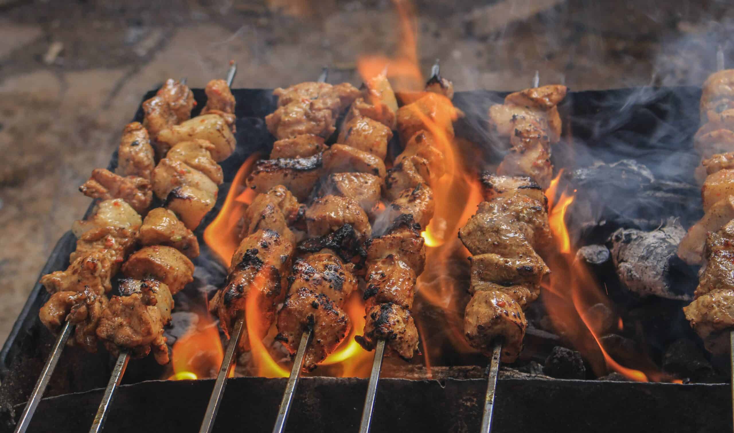Charcoal-grilled kebabs served at Three Flames