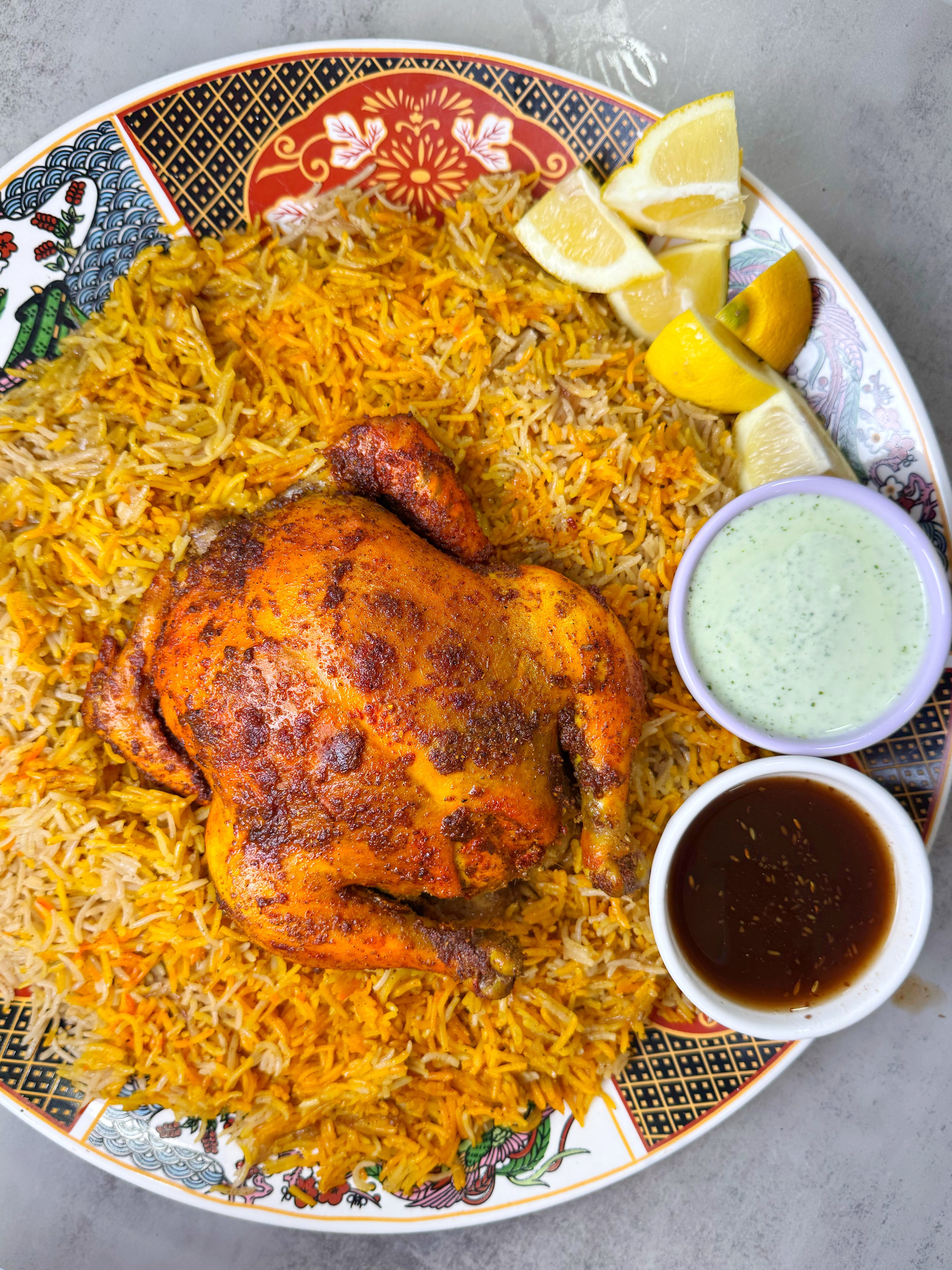 Charcoal-grilled chicken served with rice